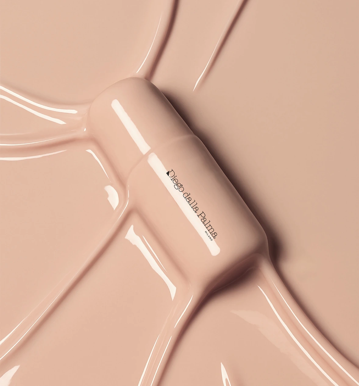 Glossy pink cream tube with Diego Dalla Palma lettering in flowing foundation texture