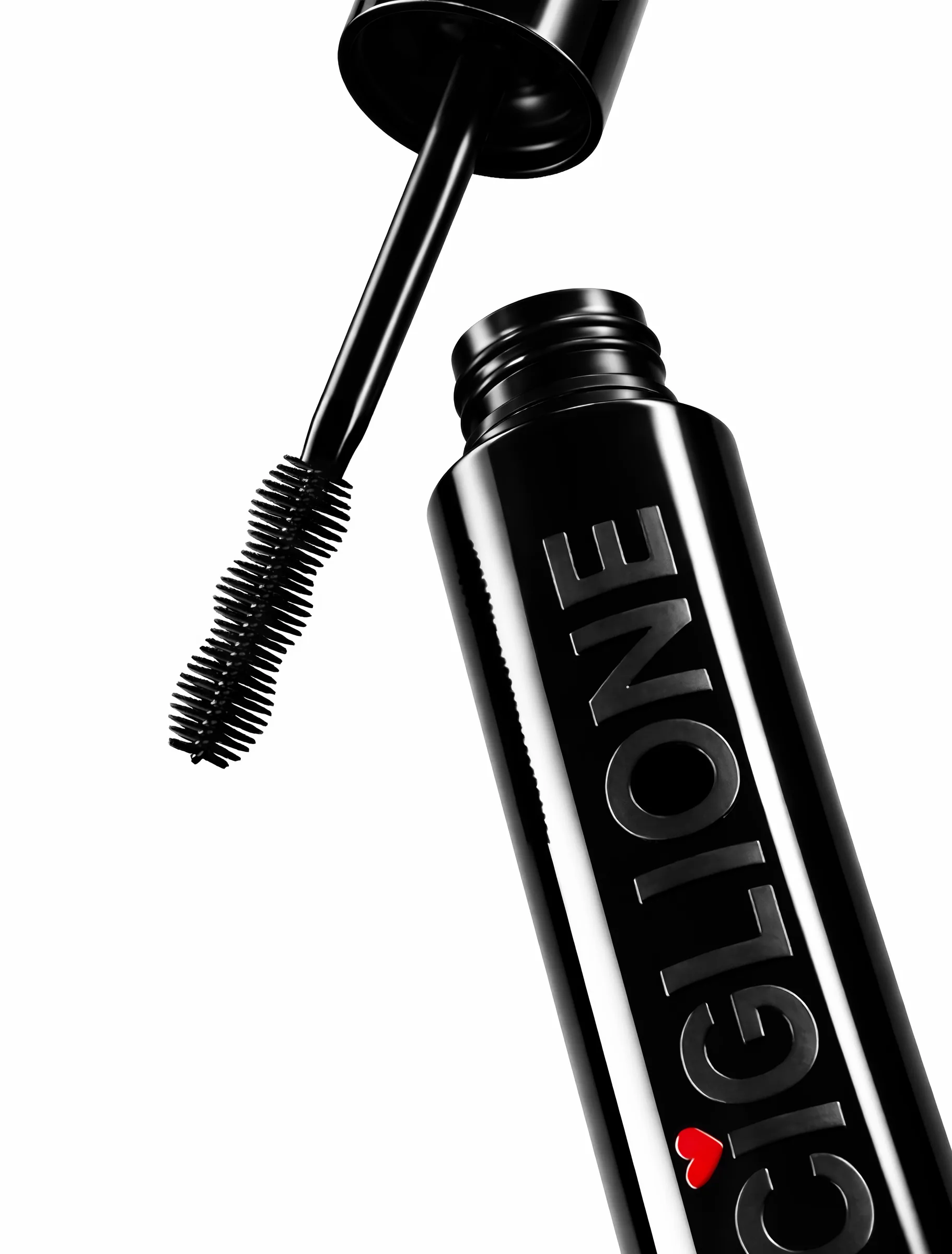Ciglione Mascara still life: the open black tube with its brush and red heart