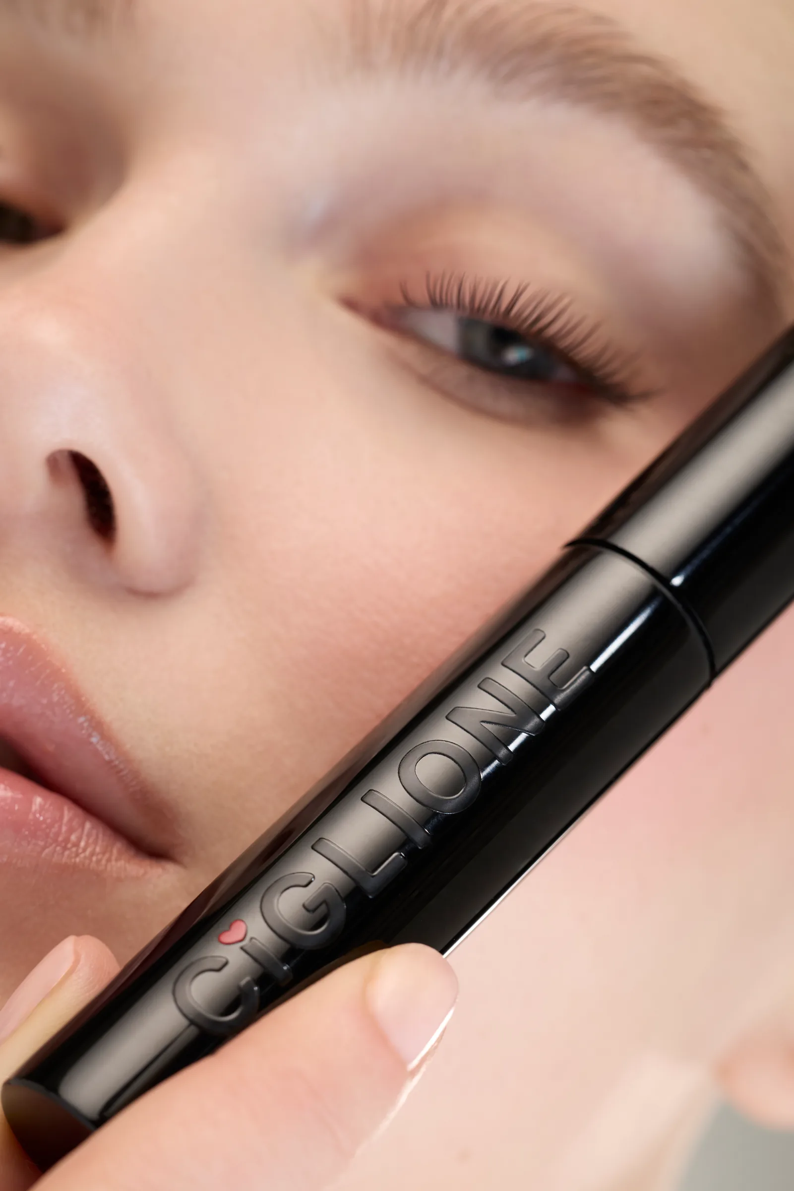 Close-up of an eye with mascara and the Ciglione tube, social campaign photo