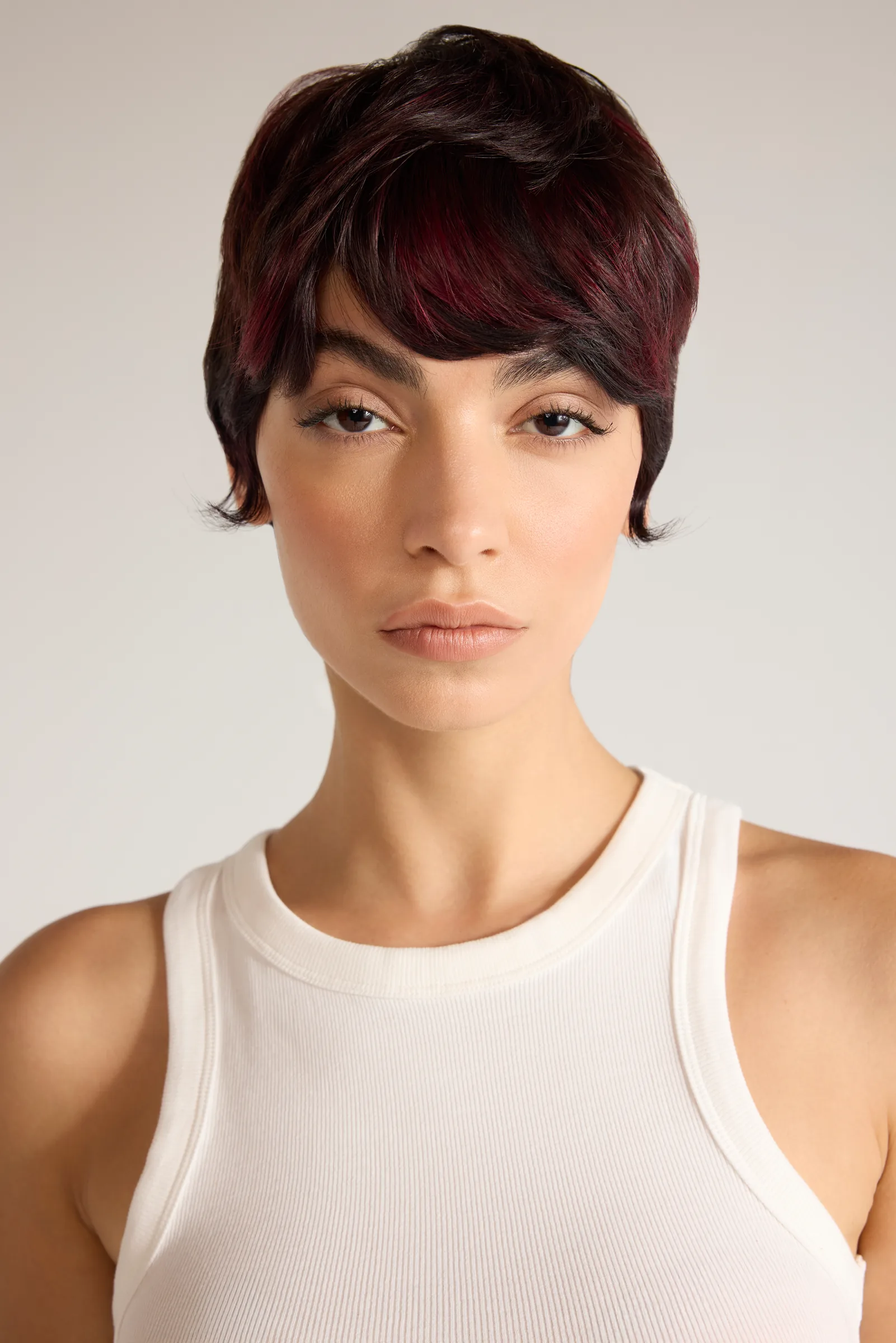 Model with a short dark cropped cut