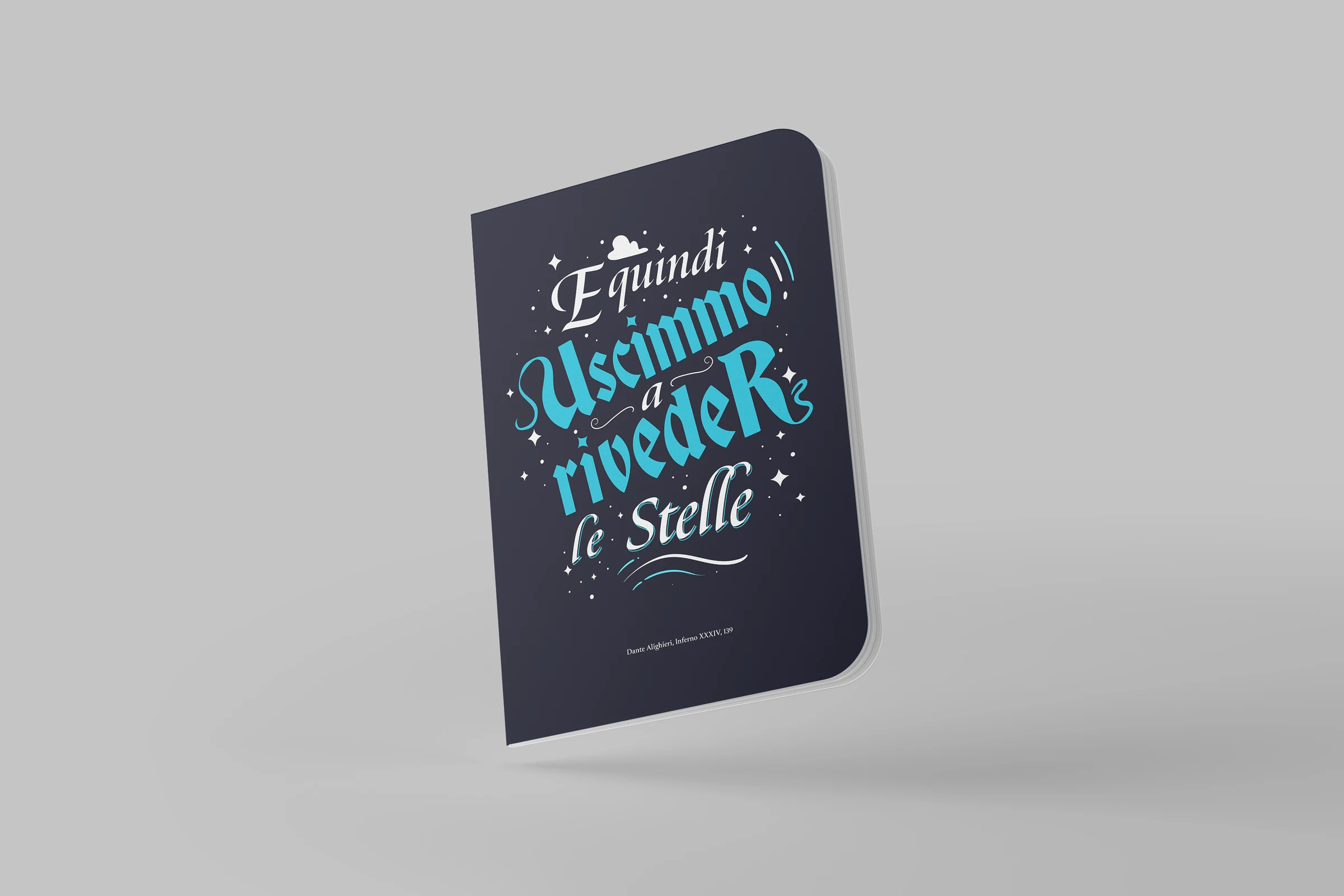 Notebook with the lettering “E quindi uscimmo a riveder le stelle” in turquoise on a dark cover