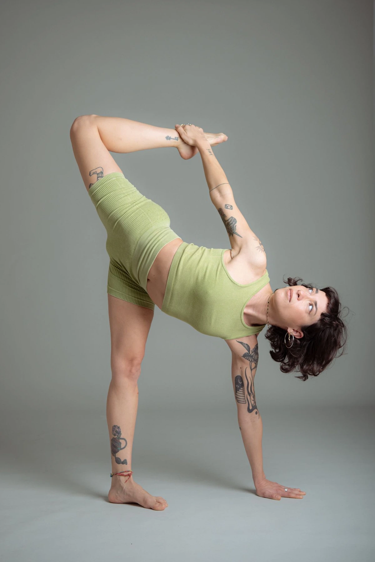 Woman in a yoga pose on a neutral background, yogacall.it identity